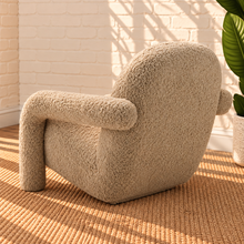 Load image into Gallery viewer, Kinsley latte beige textured upholstered accent chair with rounded back, cushioned seat and sculptural arms and legs.
