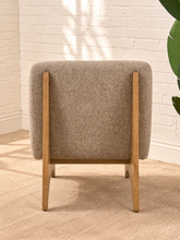 Load image into Gallery viewer, Kyro oat beige upholstered slipper chair with rounded tight back, cushioned seat and sculptural oak veneer wood legs.