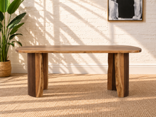 Load image into Gallery viewer, Landen oval acacia wood dining table with natural live edge top and sculptural curved double pedestal base.