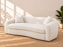 Load image into Gallery viewer, Image 3 of 5: Leighton upholstered sofa in Snow Cream sherpa with rounded silhouette, sloped arms, bench seat, and black legs
