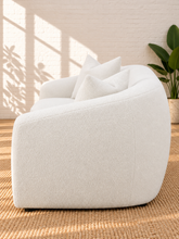 Load image into Gallery viewer, Image 4 of 5: Leighton upholstered sofa in Snow Cream sherpa with rounded silhouette, sloped arms, bench seat, and black legs