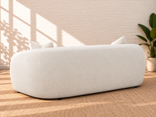 Load image into Gallery viewer, Image 5 of 5: Leighton upholstered sofa in Snow Cream sherpa with rounded silhouette, sloped arms, bench seat, and black legs
