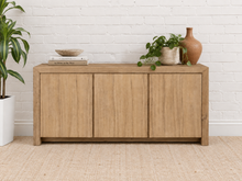 Load image into Gallery viewer, Levi three-door media cabinet in natural acacia wood with clean handle-free doors, visible wood grain and a low framed base.