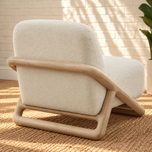 Load image into Gallery viewer, Lucia oatmeal textured lounge chair with rounded seat and back and sculptural curved natural wood sled frame