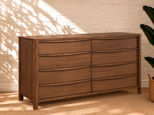 Load image into Gallery viewer, Image 3 of 4: Luciana 8-Drawer Dresser in Natural Walnut with curved drawer pulls, rounded corners, and visible wood grain