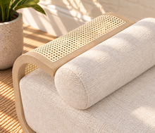 Load image into Gallery viewer, Lyca upholstered beige fabric chaise lounge with blonde oak frame, synthetic cane detailing, and curved Art Deco-inspired design