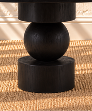 Load image into Gallery viewer, Mabel charcoal reclaimed pine round dining table with stacked cylindrical and spherical sculptural pedestal base.