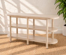 Load image into Gallery viewer, Malie natural wood open shelf console with rounded ends, two open lower shelves and slender vertical wood supports.