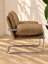 Load image into Gallery viewer, Mara tan vegan leather lounge chair with oversized cushions and polished chrome cantilever frame