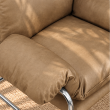 Load image into Gallery viewer, Mara tan vegan leather lounge chair with oversized cushions and polished chrome cantilever frame