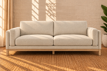 Load image into Gallery viewer, Image 1 of 4: Maraiah upholstered sofa in Oat Milk Mélange Chenille with low-profile silhouette and weathered wood base