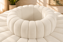 Load image into Gallery viewer, Marcy 8-piece round sectional sofa in Creamy White velvet with deep radial channel tufting and a 27-inch-diameter central circle.
