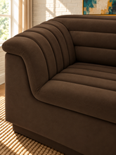 Load image into Gallery viewer, Monica 2-piece sectional sofa in Espresso velvet with deep horizontal channel tufting, curved arms, and contemporary design.