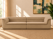Load image into Gallery viewer, Monica 2-piece sectional sofa in Honey Beige velvet with deep horizontal channel tufting, curved arms, and contemporary design.