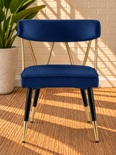 Load image into Gallery viewer, Morse dining chair in Royal Navy velvet with matte black metal legs and gold frame and leg tip details