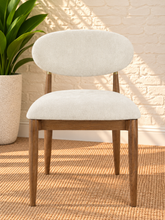 Load image into Gallery viewer, Nancy dining chair upholstered in Oat Milk performance fabric with Brown Walnut Ash Wood frame and brushed brass accents