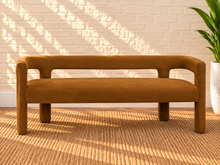Load image into Gallery viewer, Navarro dining bench in Toasted Cognac velvet with sculptural open-back frame and upholstered seat