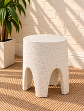 Load image into Gallery viewer, Nellie concrete side table in Ivory Terrazzo with sculptural arched legs and white terrazzo finish