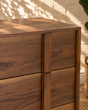 Load image into Gallery viewer, Nixon five-drawer dresser in warm walnut veneer with natural wood grain and integrated vertical wood pulls.
