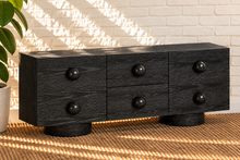 Load image into Gallery viewer, Norris Charcoal buffet credenza with oversized orb knobs, central drawers, cabinet storage, and rounded pedestal base
