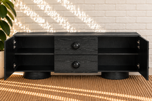 Load image into Gallery viewer, Norris Charcoal buffet credenza with oversized orb knobs, central drawers, cabinet storage, and rounded pedestal base