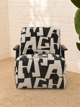 Load image into Gallery viewer, Nyla black and white geometric pattern upholstered accent chair with angular black wood arms and cushioned seat.