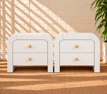 Load image into Gallery viewer, Pair of Blanca 2-drawer ash wood nightstands in Arctic White with curved frames and fluted drawer fronts.
