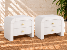 Load image into Gallery viewer, Pair of Blanca 2-drawer ash wood nightstands in Arctic White with curved frames and fluted drawer fronts.