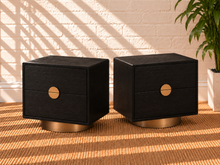 Load image into Gallery viewer, Pair of Jimena charcoal two-drawer nightstands with oak veneer and brushed brass metal bases and handles.