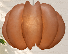 Load image into Gallery viewer, Piper hanging lamp in terracotta resin with overlapping curved panels, a rounded sculptural silhouette, textured surface, and dark cord suspension.