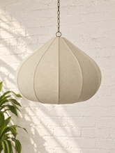 Load image into Gallery viewer, Poppy hanging lamp in sand with a rounded sculptural shade, textured surface, vertical rib detailing, and metal chain suspension.
