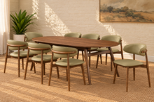 Load image into Gallery viewer, Reed Walnut dining chair upholstered in Desert Khaki vegan leather with curved backrest and solid wood frame