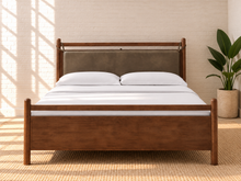 Load image into Gallery viewer, Rocco Queen platform bed with Walnut rubberwood frame, Taupe faux leather upholstered headboard pillow, and decorative leather straps.