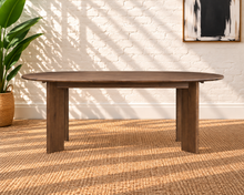 Load image into Gallery viewer, Rohan 79-inch oval dining table in dark walnut solid Mindi wood with rounded tabletop edges and architectural panel legs.