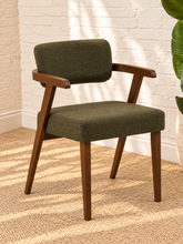 Load image into Gallery viewer, Royce dining armchair with deep olive textured upholstery, curved cushioned back, and walnut-finished solid rubberwood frame.