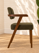 Load image into Gallery viewer, Royce dining armchair with deep olive textured upholstery, curved cushioned back, and walnut-finished solid rubberwood frame.