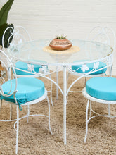 Load image into Gallery viewer, Vintage Wrought Iron Patio Dining Table with Leaf Motif Aqua Cushions and Glass Top