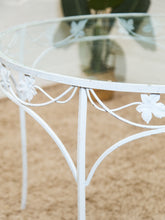 Load image into Gallery viewer, Vintage Wrought Iron Patio Dining Table with Leaf Motif Aqua Cushions and Glass Top