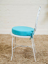 Load image into Gallery viewer, Vintage Wrought Iron Patio Dining Table with Leaf Motif Aqua Cushions and Glass Top