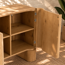 Load image into Gallery viewer, Sadie natural oak four-door credenza with rounded edges, integrated legs, white oak veneer, and interior shelving.