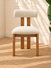 Load image into Gallery viewer, Sandra dining chair with off-white bouclé upholstered seat and backrest, high-density foam cushioning and natural solid ash wood frame.