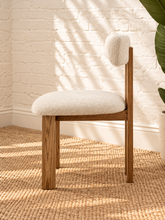 Load image into Gallery viewer, Sandra dining chair with off-white bouclé upholstered seat and backrest, high-density foam cushioning and natural solid ash wood frame.