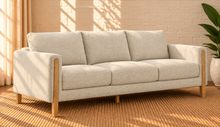 Load image into Gallery viewer, Image 2 of 4: Serano 75-inch three-seater sofa in Oatstone brushed Boucle fabric with tapered wood legs and cushioned seating