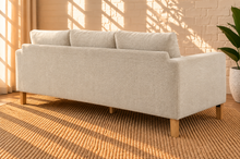 Load image into Gallery viewer, Image 3 of 4: Serano 75-inch three-seater sofa in Oatstone brushed Boucle fabric with tapered wood legs and cushioned seating
