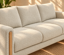 Load image into Gallery viewer, Image 4 of 4: Serano 75-inch three-seater sofa in Oatstone brushed Boucle fabric with tapered wood legs and cushioned seating