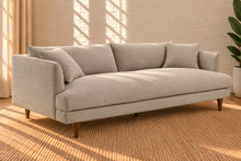 Load image into Gallery viewer, Image 2 of 5: Shelby upholstered sofa in Stone Mist boucle fabric with deep lounge seating, loose cushions, and tapered Rubberwood legs