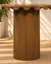 Load image into Gallery viewer, Solenn counter height table in Warm Walnut oak veneer with round tabletop, scalloped edge detail, and cylindrical pedestal.