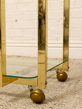 Load image into Gallery viewer, Vintage Hollywood Regency Brass Bar Cart with Glass Shelves