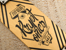 Load image into Gallery viewer, Close-up of a skateboard deck with a light natural wood base and black graphic artwork. The design features the text 'Krypt onics' in stylized script, 'Fast Rains' in a banner, 'Skateboards Since 1965' on another banner, and black diagonal stripes along the edges.