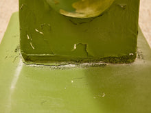 Load image into Gallery viewer, Close-up detail of a green painted metal surface with chipped and peeling paint, showing the texture and wear on a flat base with a vertical panel attached.